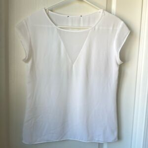 Nameless women top in white, most likely small